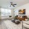 Large window and ceiling fan in apartment living rooms at The Groves at Lake Juliana