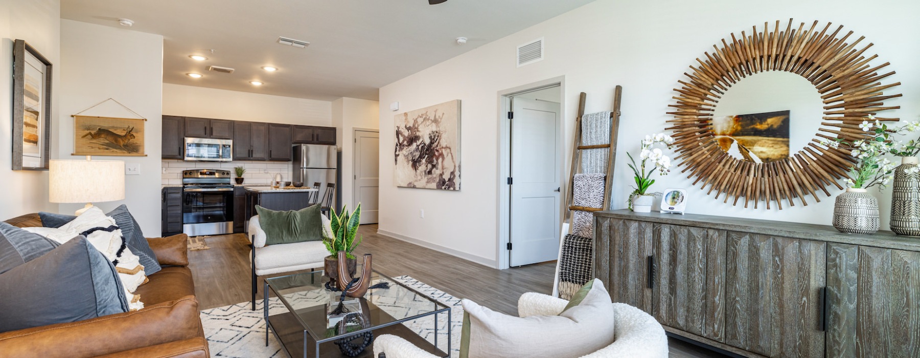 Living Room with ceiling fan and plank flooring